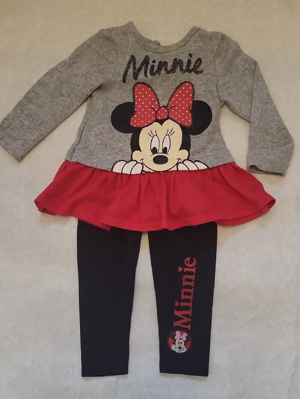 Disney long sleeve peplum top with black leggings